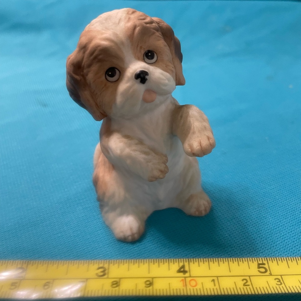 Tiny ceramic white and brown begging puppy figurine